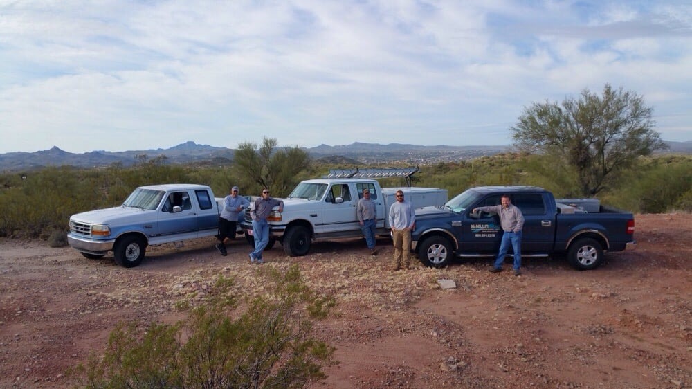McMillin Air's crew and trucks lined up in the Wickenburg desert
